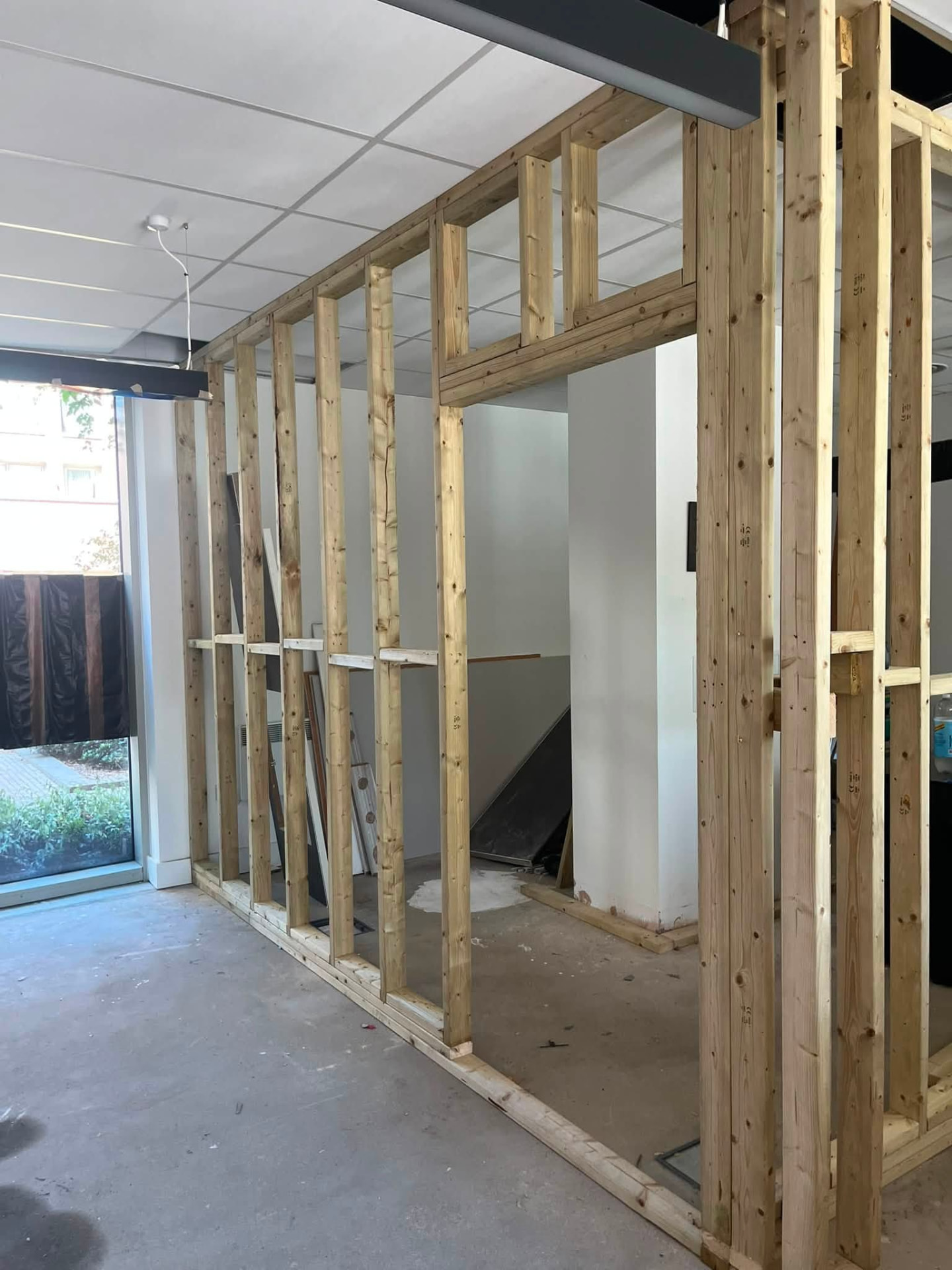 Partition framing nearing completion with overhead noggins fixed